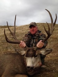 a man holding a horn's deer