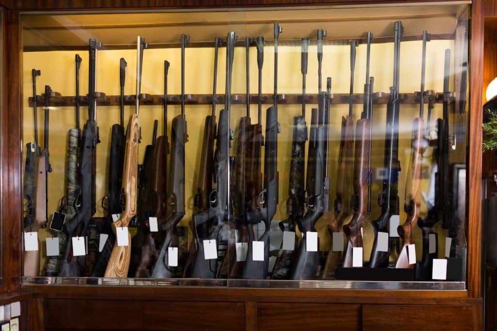A display case showcasing numerous guns. Perfect for guided hunts, elk hunt trips, and a hunting company.